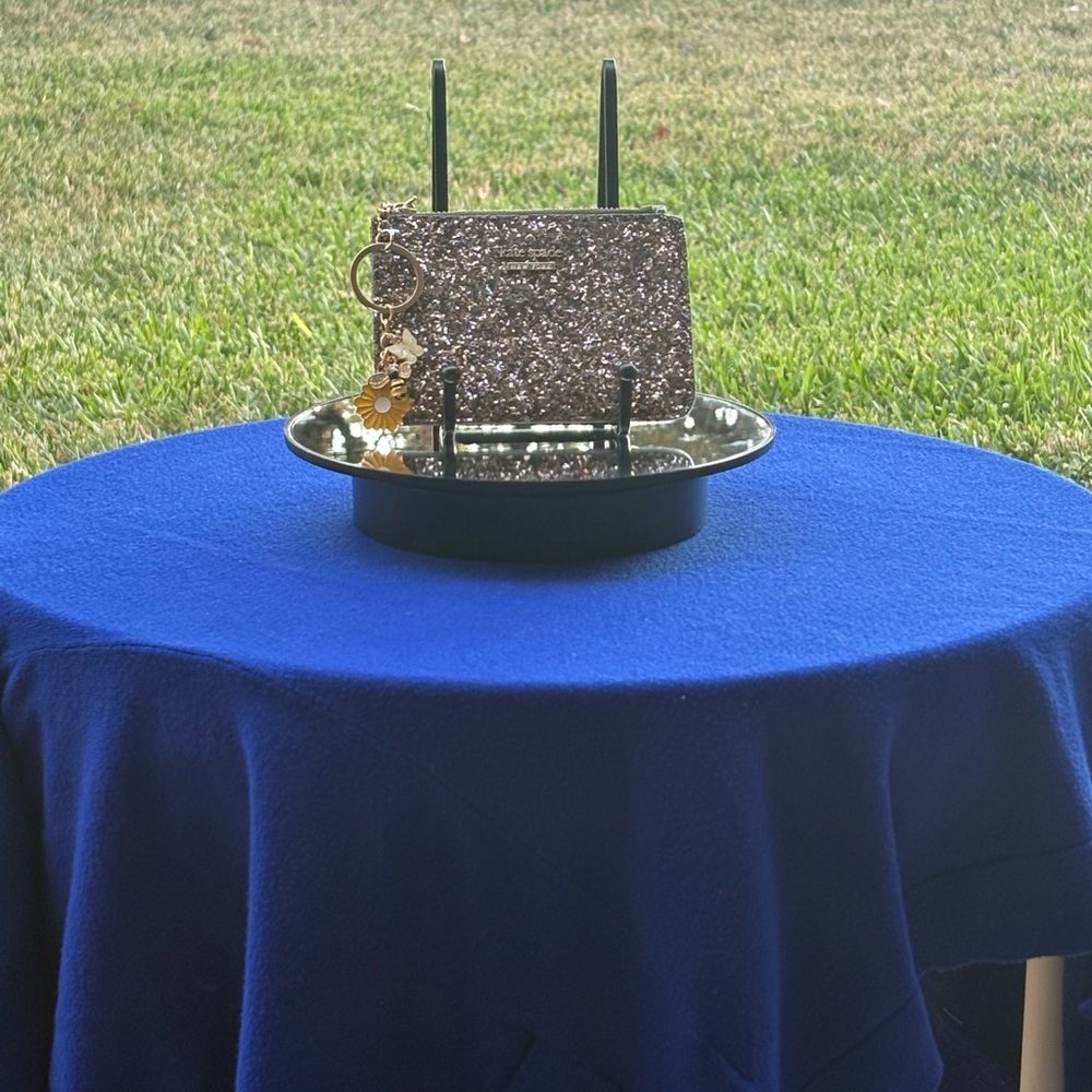Kate Spade Glittery Card holder. New w/o box. MSRP $89.00. Price: $35.00.
